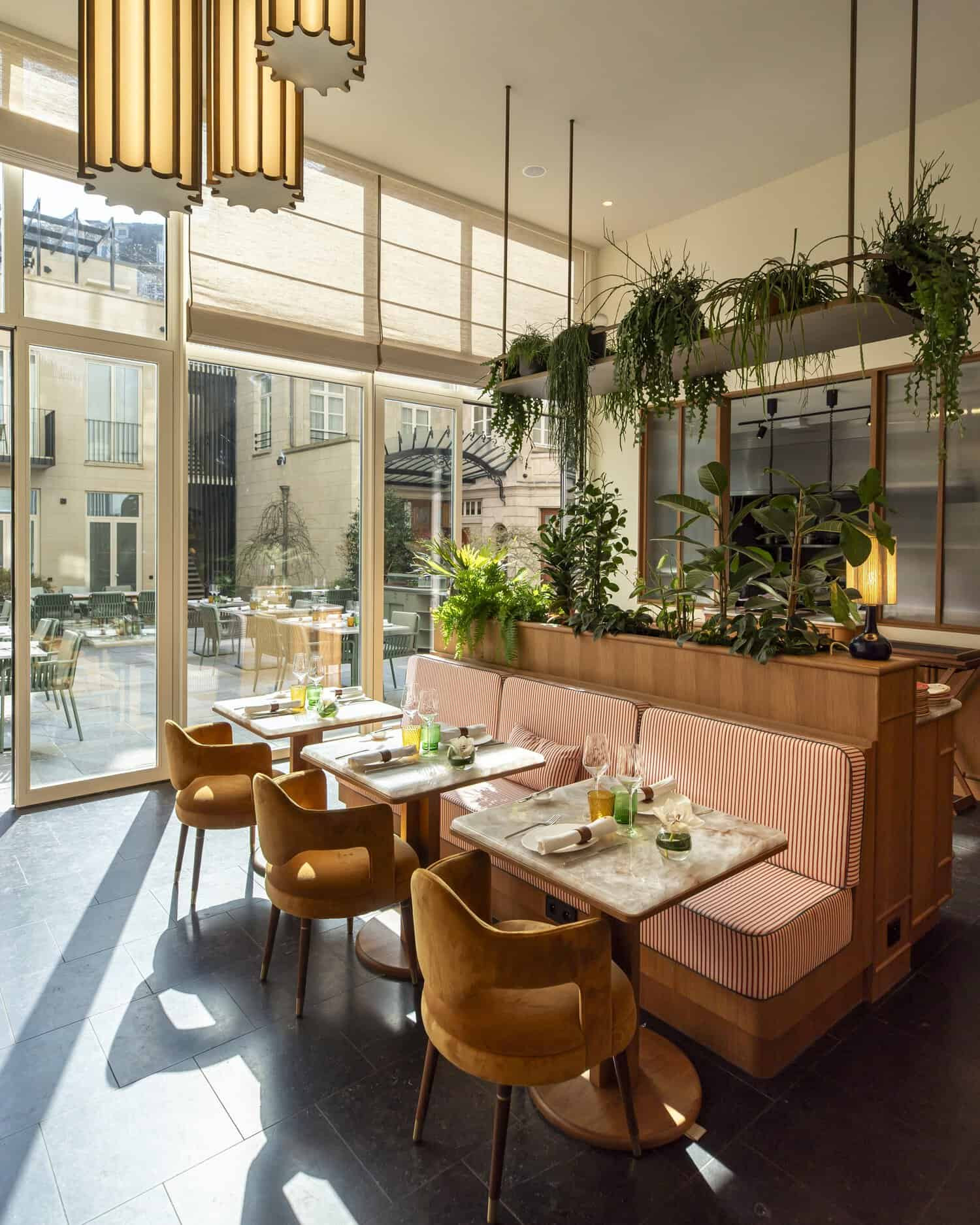 Dining area at Noisette with an interior courtyard and vibrant décor